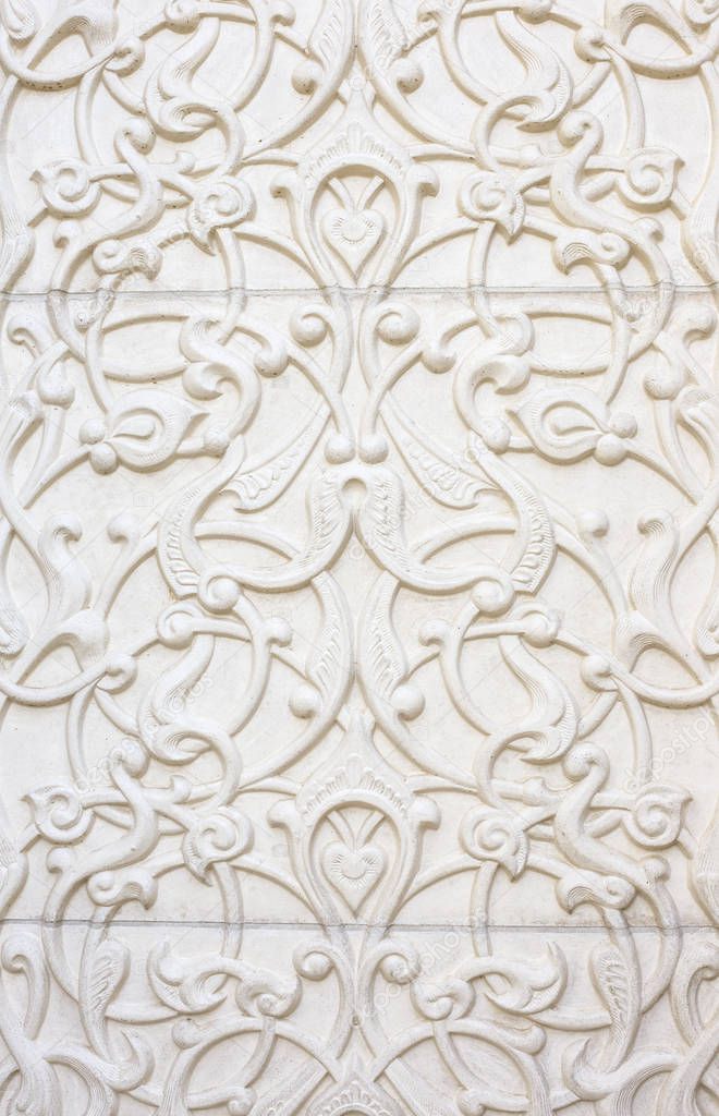 Arabic islamic patterns on a white stone