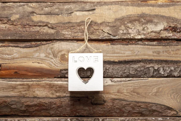 Valentine's day love heart shaped cube decoration on rustic style wooden background with copy space. Holiday card for valentine's day. — Stock Photo, Image