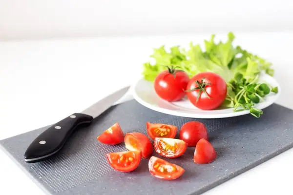 Slices Cherry Tomatoes Grey Chopping Board Knife White Background Tomatoes — Stock Photo, Image