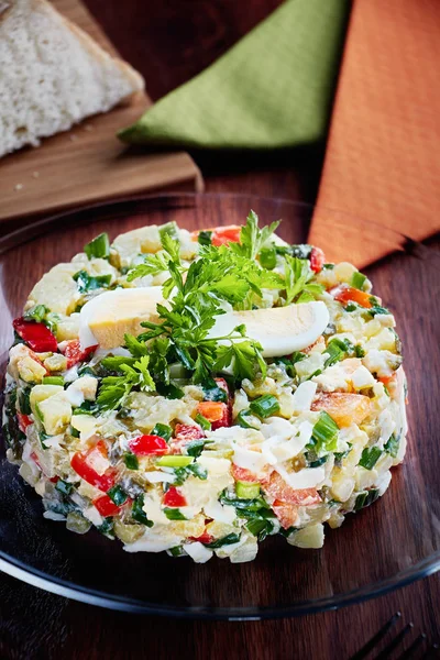 Olivier Salad or Russian Salad with Salmon and Red Caviar