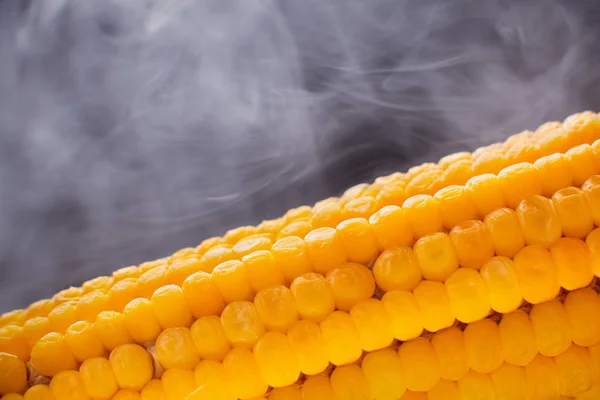 Grains of ripe corn on dark background — Stock Photo, Image