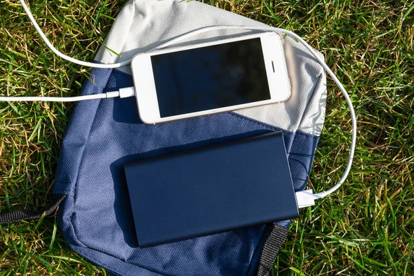 power Bank and phone on the grass