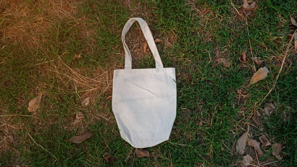 cloth bag on the grass field