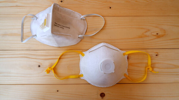 Mask for protection PM 2.5 dust on wooden table