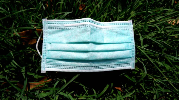 Surgical mask for virus protection on the grass