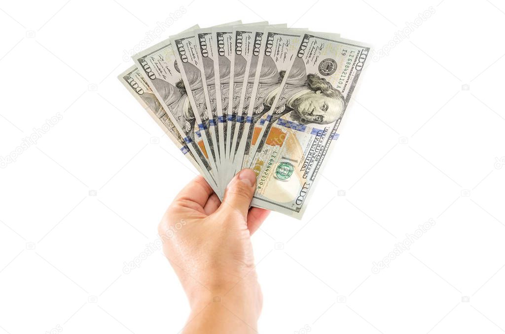 dollars in hand on a white background