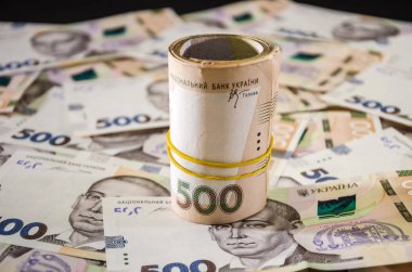 Yuvarlanan Ukrayna Hryvnia 'sı. Para geçmişi. İş konsepti.