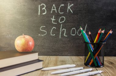School blackboard with text 'Back to school' . September and education concept