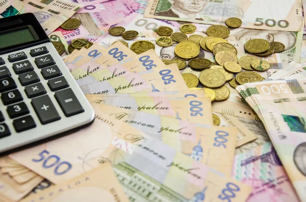 乌克兰格里夫尼亚 计算器和硬币 资金背景 业务概念 — 图库照片