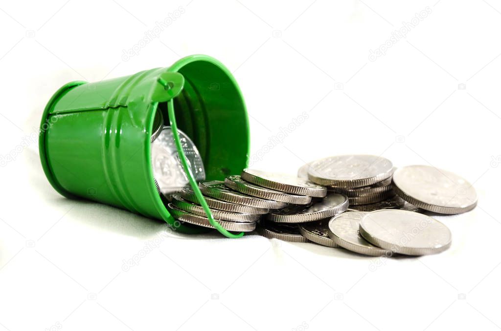 bucket from which coins are poured, isolated on white background