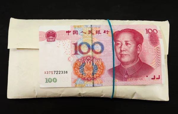 Stack of Chinese Yuan Money in Red Envelope Stock Image - Image of