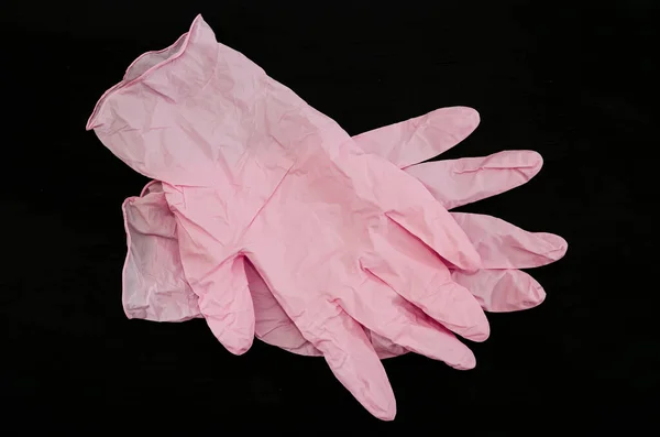 Rosa Handschuhe Auf Schwarzem Hintergrund Medizinische Handschuhe — Stockfoto