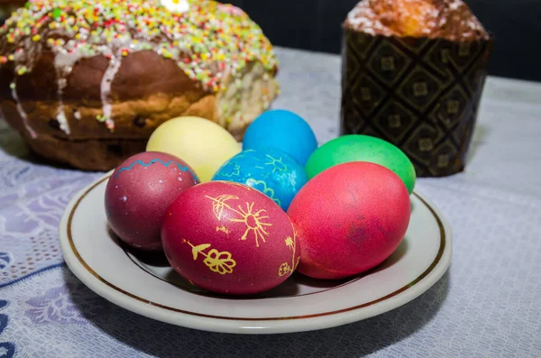 Easter concept. Easter cake, multi-colored eggs on the festive table.