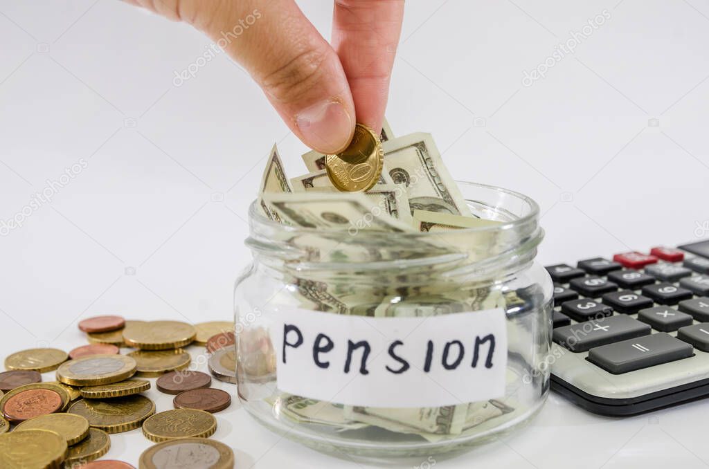 hand puts a coin in a glass jar. Pension concept. White background. Money saving concept.