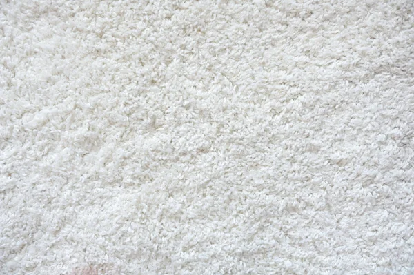 Piękna faktura białego dywanu. Tekstura białego polarnego dywanu — Zdjęcie stockowe