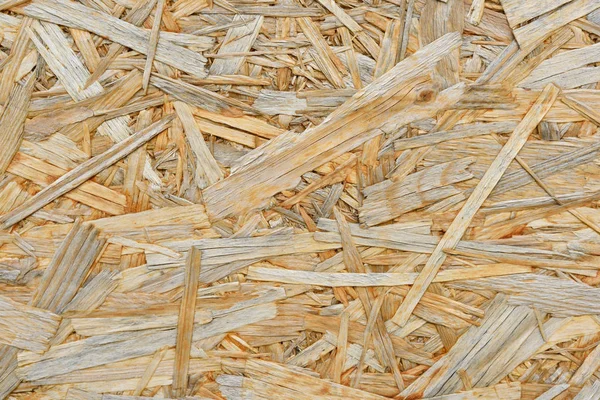 Texture of plywood from large wood chips close up — Stock Photo, Image