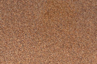 Kahverengi kumlu kumsalın güzel yüzey dokusu