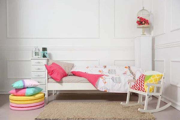 Beautiful children 's bed in different colors — стоковое фото