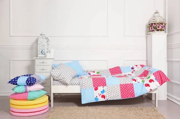 Beautiful children's bed in different colors — Stock Photo, Image