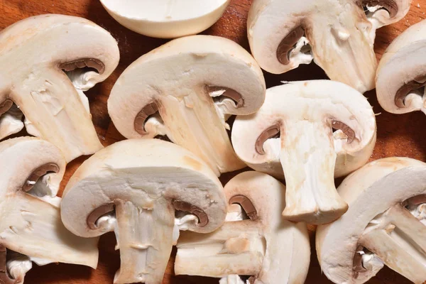 Cut large mushrooms close-up on a white background. Cutted mushrooms by cuts