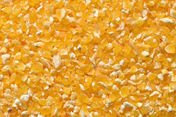 Yellow corn grits close-up. Raw corn grits for breakfast porridge