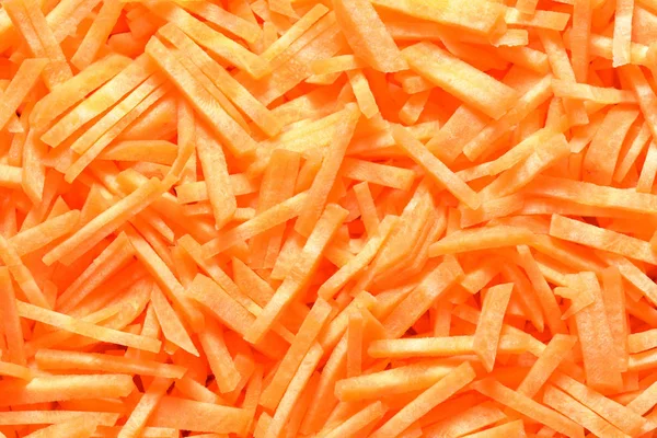 Textura de cenouras brilhantes e maduras fatiadas. Close-up — Fotografia de Stock