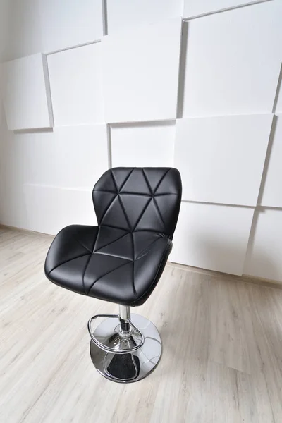 Beautiful bar chair, black, with elements of a triangle. The bar