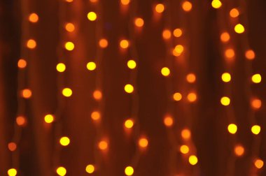 Bokeh çelenk, mercek çözücü. Bulanık sarı ve turuncu renkler.