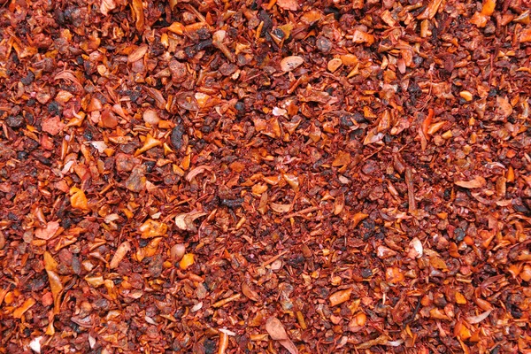 Dry seasoning of sweet pepper paprika, close-up from the seller in the market.