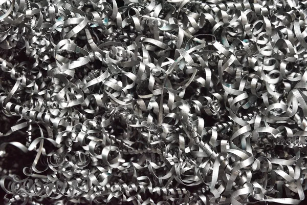 Pile of metal shavings after working on milling machine or CNC machine.