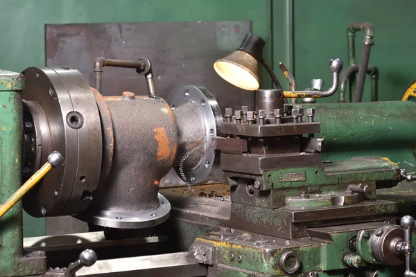 The body of the valve installed on the old milling machine to cut the edges.