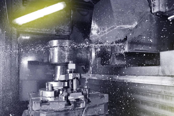 The process of drilling and grinding holes in the body of the valve on the CNC machine.