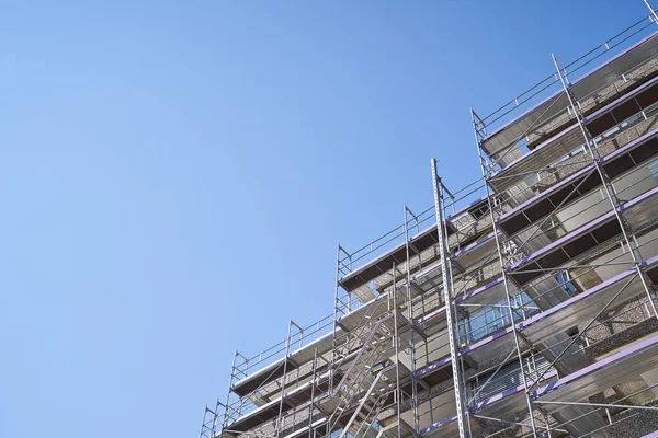 Scaffolding installed on a residential building for the restoration of the facade