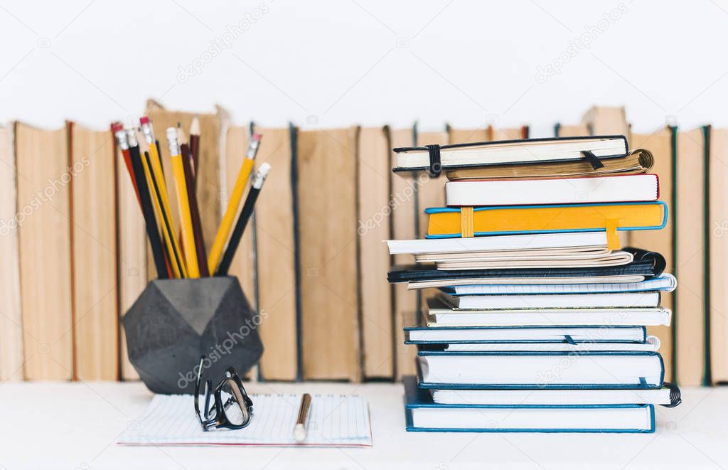 Notebooks piles, stack of books education back to school backgro