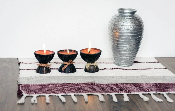Cozy home interior decor, burning candles in coconut shell on a — Stock Photo, Image