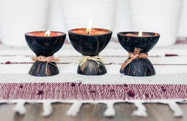 Cozy home interior decor background, burning candles in coconut — Stock Photo, Image