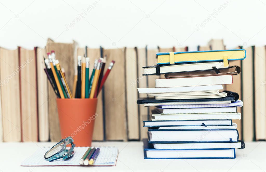 Notebooks piles, stack of books education back to school backgro