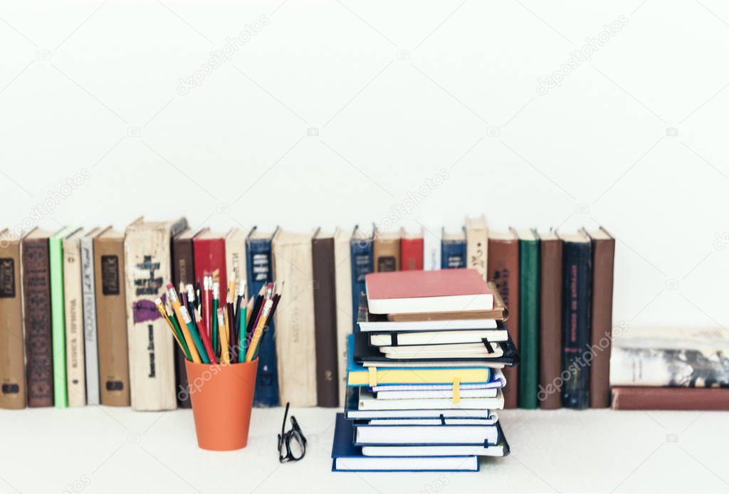 Notebooks piles, stack of books education back to school backgro