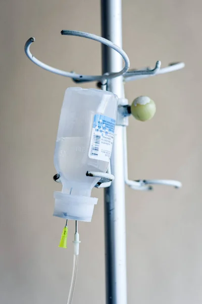 Close-up bottle of medicine on dropper system in the operating room (medical background with an intravenous IS)