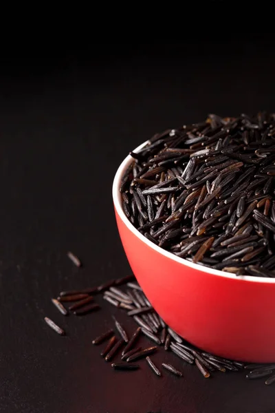 Black rice in  red bowl — Stock Photo, Image