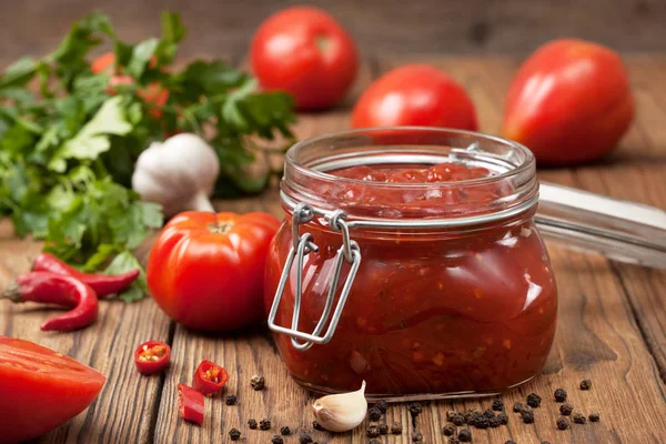 Tomato sauce in a glass jar — Stock Photo, Image