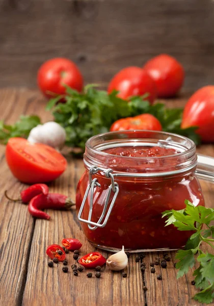 Tomato sauce in a glass jar — Stock Photo, Image