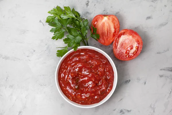 Tomato sauce in a white bowl — Stock Photo, Image