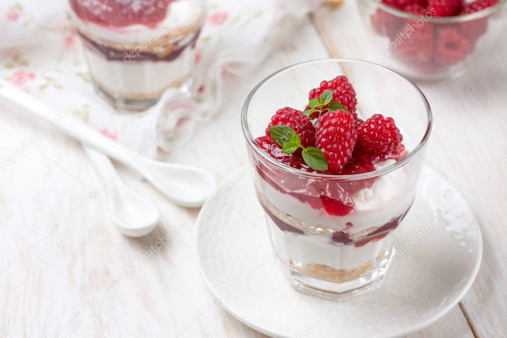 cheesecake with raspberries in glasses 