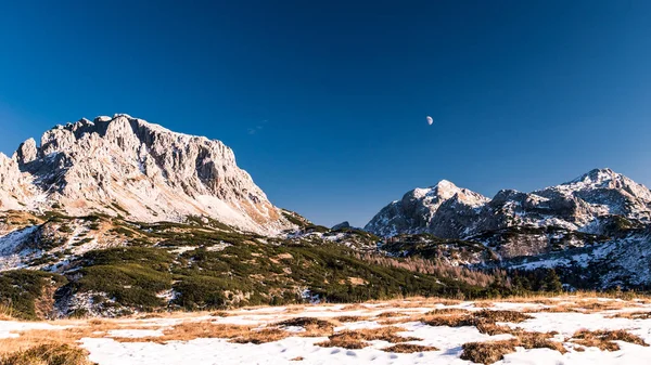 Moon is rising behind the mountains — стоковое фото