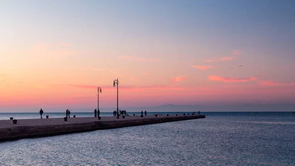 Sunset in front of the city of Trieste — Stock Photo, Image