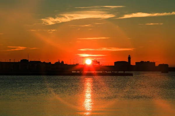 Puesta de sol frente a la ciudad de Trieste —  Fotos de Stock