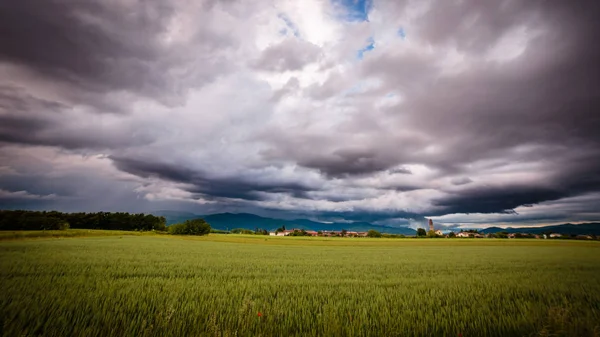 Evening storm over the medieval village — Stock Photo, Image