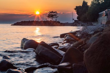 Denizde, Trieste günbatımı