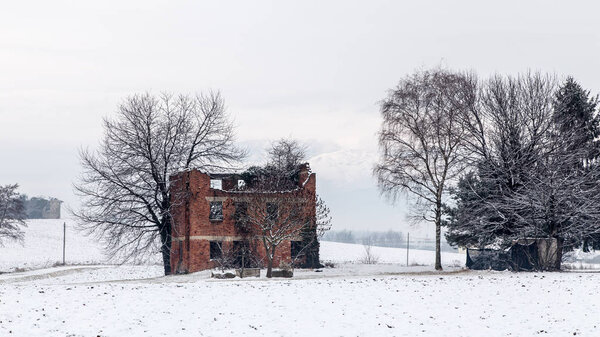 snow covering an abandoned farm